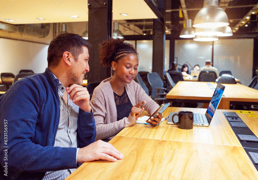 portrait two multiracial businessmen sitting in the meeting room or coworking looking at the cell phone smiling relaxed portrait two multiracial businessmen sitting in the meeting room or coworking looking at the cell phone smiling relaxed