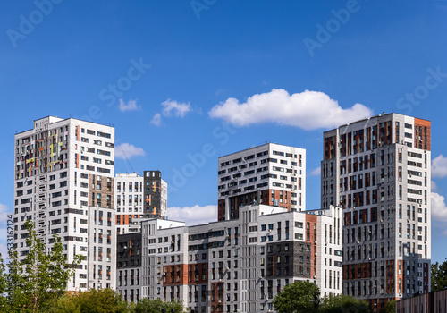 New modern residential apartment building against blue sky	