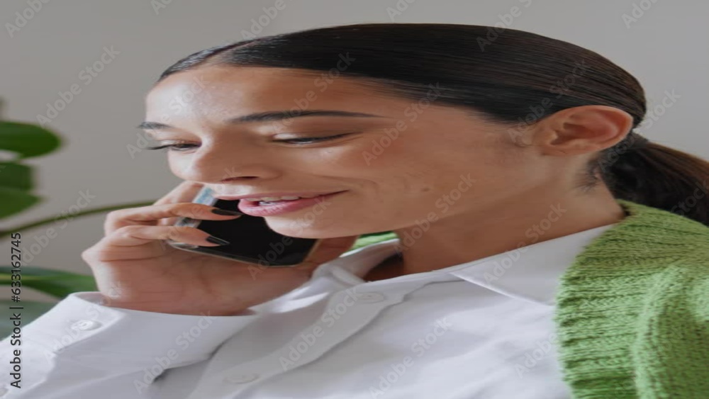 Smiling woman talking mobile phone call at house vertical closeup. Lady calling Smiling woman talking mobile phone call at house vertical closeup. Lady calling