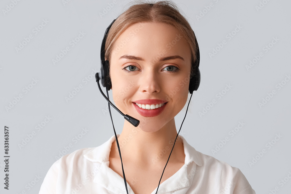 Female technical support agent on light background Female technical support agent on light background