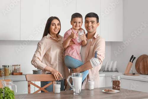 Little boy with his parents...