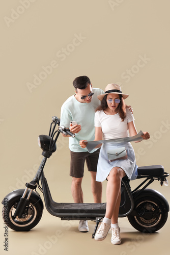 Young couple with map and e...