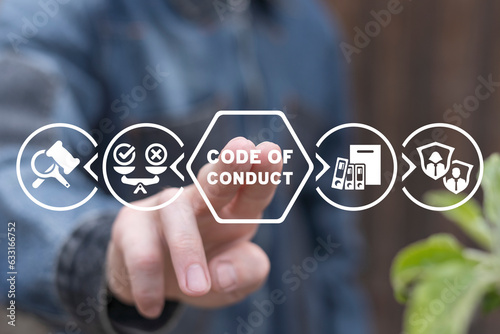Cuadro en lienzo Man using virtual touch screen presses inscription: CODE OF CONDUCT