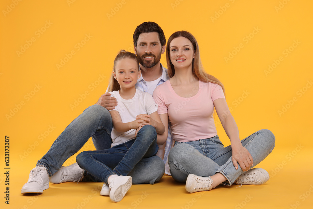 Portrait of happy family on orange background Portrait of happy family on orange background
