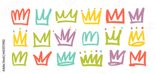 Set of colorful doodle shapes crowns. Brush drawn collection of symbols. Creative modern marker design. Various multi colored vector crowns isolated on white. Graffiti style doodle elements.