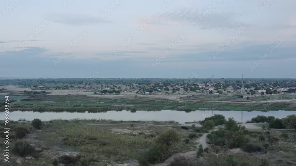 River flowing through small African townv