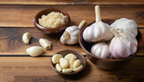 Three bowls of whole and processed garlic on a wooden table. A popular spice for the kitchen.
