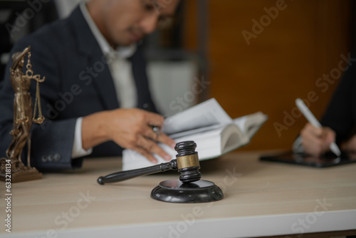 Male lawyer businessman sitting in the office doing legal work.