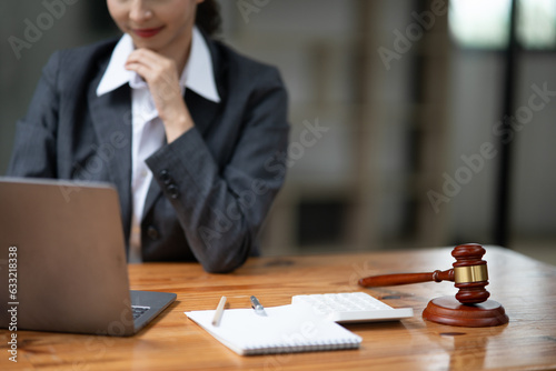 Lawyers Asiawoman   having through online Concepts  of Legal services at the law office. photo