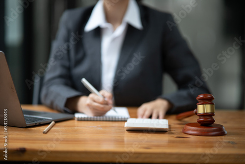 Lawyers Asiawoman   having through online Concepts  of Legal services at the law office. photo