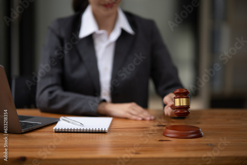 Lawyers Asiawoman   having through online Concepts  of Legal services at the law office. photo