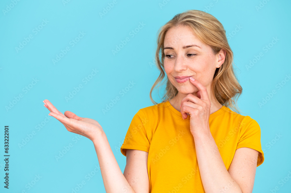 Smiling pensive woman holding hand blank copy space aside Smiling pensive woman holding hand blank copy space aside