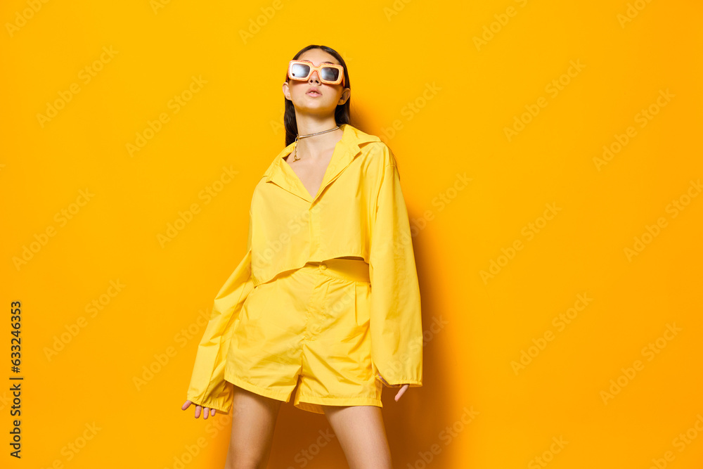 Fototapeta premium yellow woman beautiful young girl fashion lovely sunglasses attractive trendy lifestyle