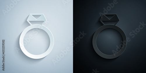 Paper cut Diamond engagement ring icon isolated on grey and black background. Paper art style. Vector