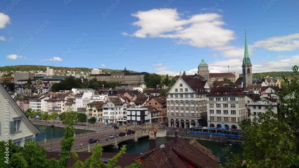 03-08-2023 Zurich city Switzerland. Above angle view of the old part of downtown. Limmat river in the foreground, light traffic over the bridge, hillside over the river with ETH and EZh university bui