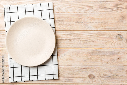 Принти на полотні Top view on colored background empty round white plate on tablecloth for food