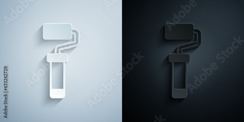 Paper cut Paint roller brush icon isolated on grey and black background. Paper art style. Vector