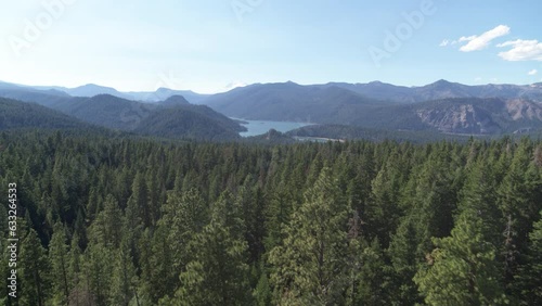 Aerial of Rimrock Lake with far view of Mount Rainier in background in Washington in summer photo