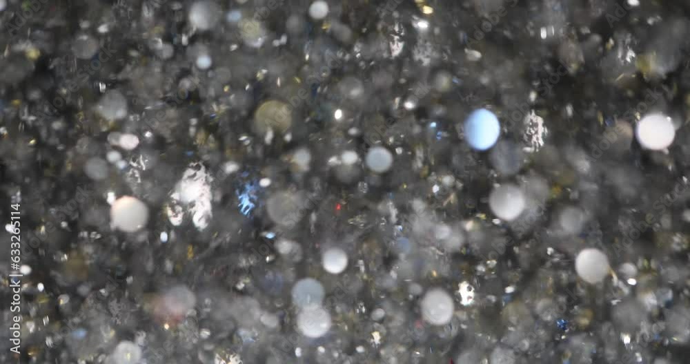 Elegant silver abstract art with flying sequins. Christmas animated gray background