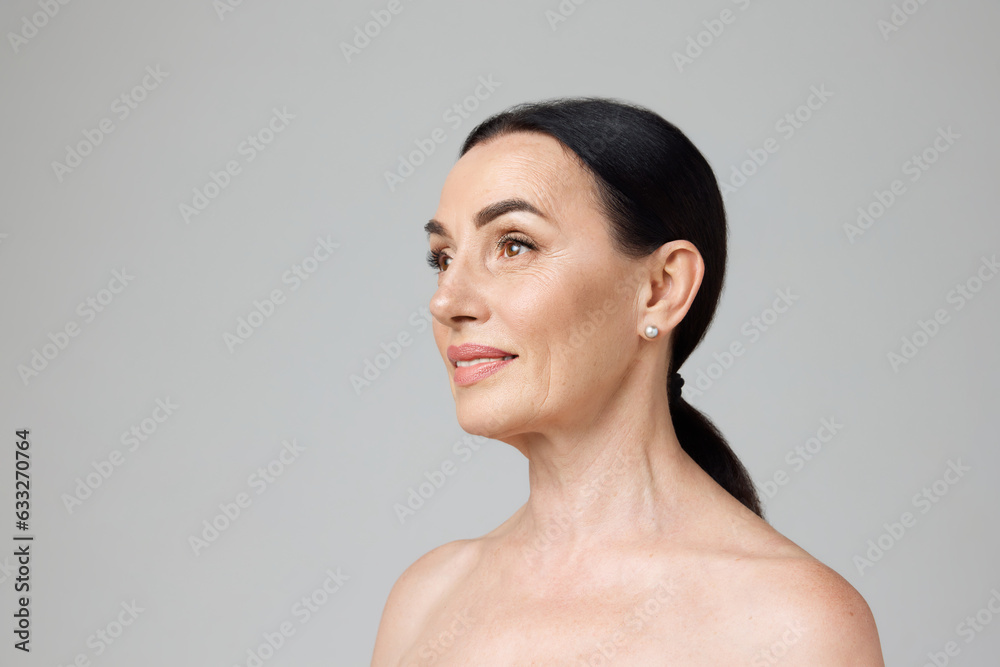 Profile photo smiling beautiful mature woman with bare shoulders ...