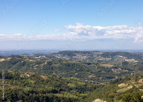 View of the Langhe-Roero hills and vineyards in Piedmont with the Alps in the background. Italy © wjarek