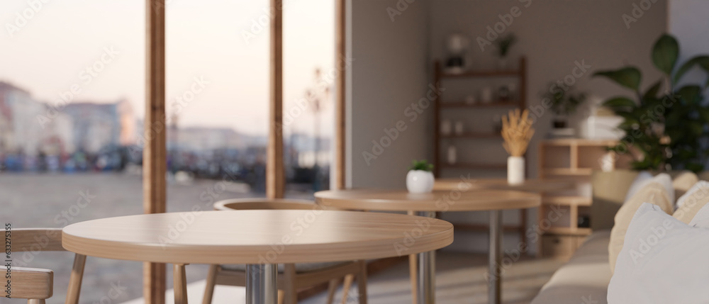 A copy space on a wooden round table in a cozy, Scandinavian coffee shop or restaurant.