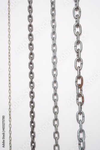 Metal chains on a white background.