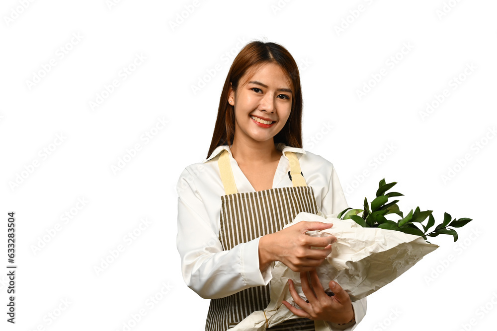 Beautiful female florist wearing apron holding plant isolated on white background. Beautiful female florist wearing apron holding plant isolated on white background.