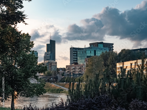 Vilnius, Lithuania - 07 30 2023: Buildings on the embankment of the Neris River in the center of Vilnius