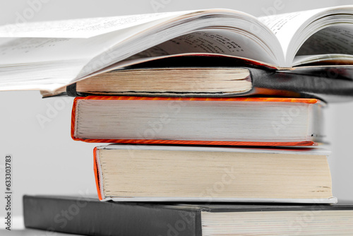 Open book on a stack of books close up. School concept.