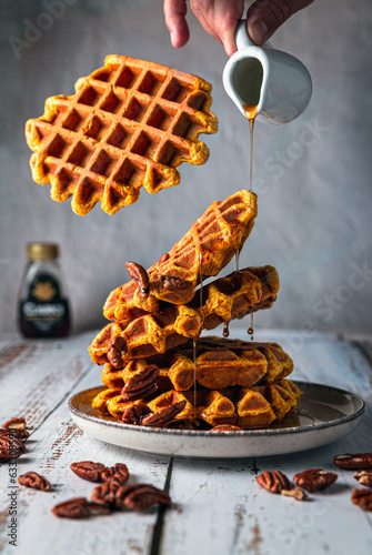 Flying waffles with maple syrup 