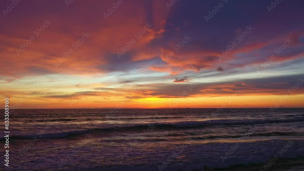 .Beautiful pink sky in sunset above the ocean..Scene of romantic beautiful red sky sunset with Waves crashing on the pink beach..Gradient color. reflection Sky texture background. .Beautiful pink sky in sunset above the ocean..Scene of romantic beautiful red sky sunset with Waves crashing on the pink beach..Gradient color. reflection Sky texture background.