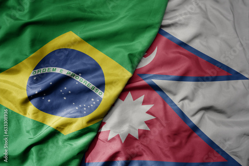 big waving realistic national colorful flag of brazil and national flag of nepal .