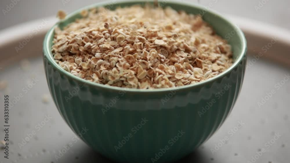 blue bowl of raw oats close up blue bowl of raw oats close up