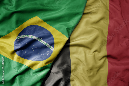 big waving realistic national colorful flag of brazil and national flag of belgium .