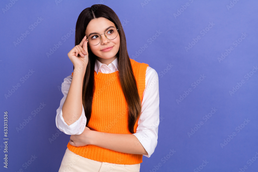 Portrait of clever girl with long hairstyle wear stylish shirt touch glasses look empty space promo isolated on violet color background Portrait of clever girl with long hairstyle wear stylish shirt touch glasses look empty space promo isolated on violet color background