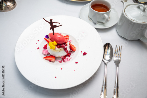 Pavlova dessert with chocolate ballerina