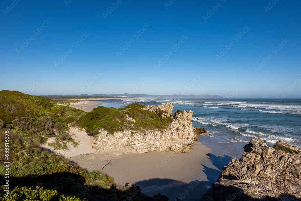 View of Lovers' Cove and in the background, Grotto Beach and Klein Rivier Estuary in the distance. Hermanus, Whale Coast, Overberg, Western Cape, South Africa. View of Lovers' Cove and in the background, Grotto Beach and Klein Rivier Estuary in the distance. Hermanus, Whale Coast, Overberg, Western Cape, South Africa.