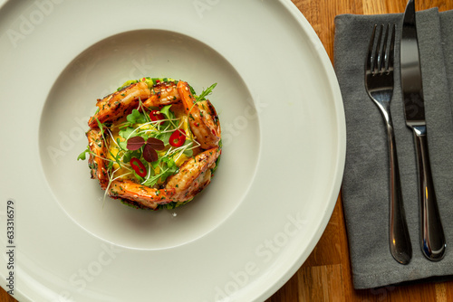 Shrimps salad with herbs and flowers overhead shoot