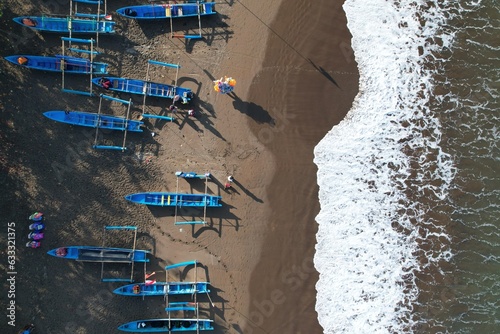 fishing boats anchored on the shore. Indonesia is the largest maritime country in the world that produces a lot of fish catches from the ocean. kapal nelayan pantai Pangandaran. aerial view of shore. 