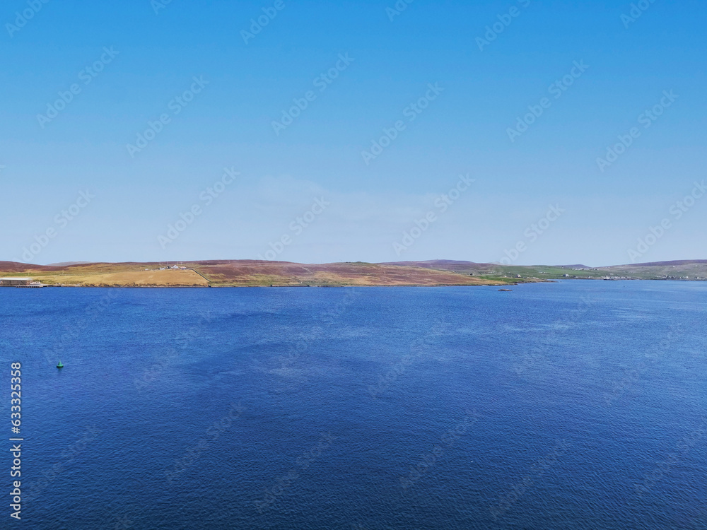 Tranquil Horizon over Holmsgarth: Blue Sky and Clear Seascape