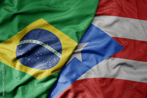 big waving realistic national colorful flag of brazil and national flag of puerto rico .