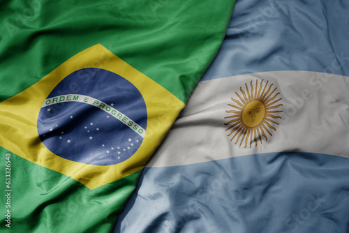 Fotografía big waving realistic national colorful flag of brazil and national flag of argentina