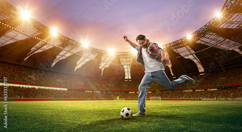 Emotional man hitting football ball on open air arena with flashlights. Netting and match. 3d render. Concept of sport  fan  betting and finances  gambling  bookmaker