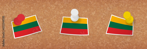 Lithuania flag pinned in cork board, three versions of Lithuania flag.