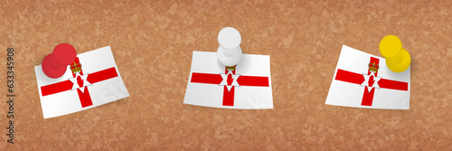 Northern Ireland flag pinned in cork board, three versions of Northern Ireland flag.