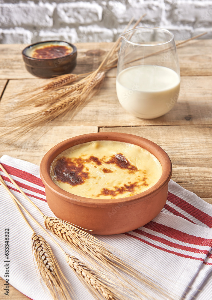 Rice pudding close up wooden table background and milk. Rice pudding close up wooden table background and milk.