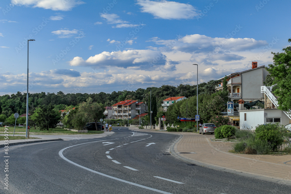 Asphalt road to the port on the island of Rab in Croatia