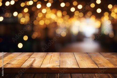  Empty wooden table with golden background , bokeh and glitter particles, evoking a fantastical and enchanted atmosphere. Golden abstract background with sprinklings of diffused lights, bokeh.