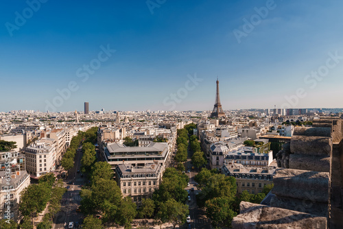 Oblique view of Paris cityscape from the top of the Eiffel Tower on a sunny summer day.